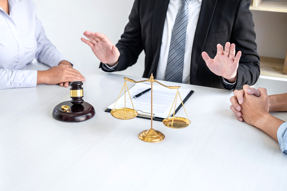 Unhappy divorce couple having conflict, Man and wife conversation during divorce process with male lawyer or counselor